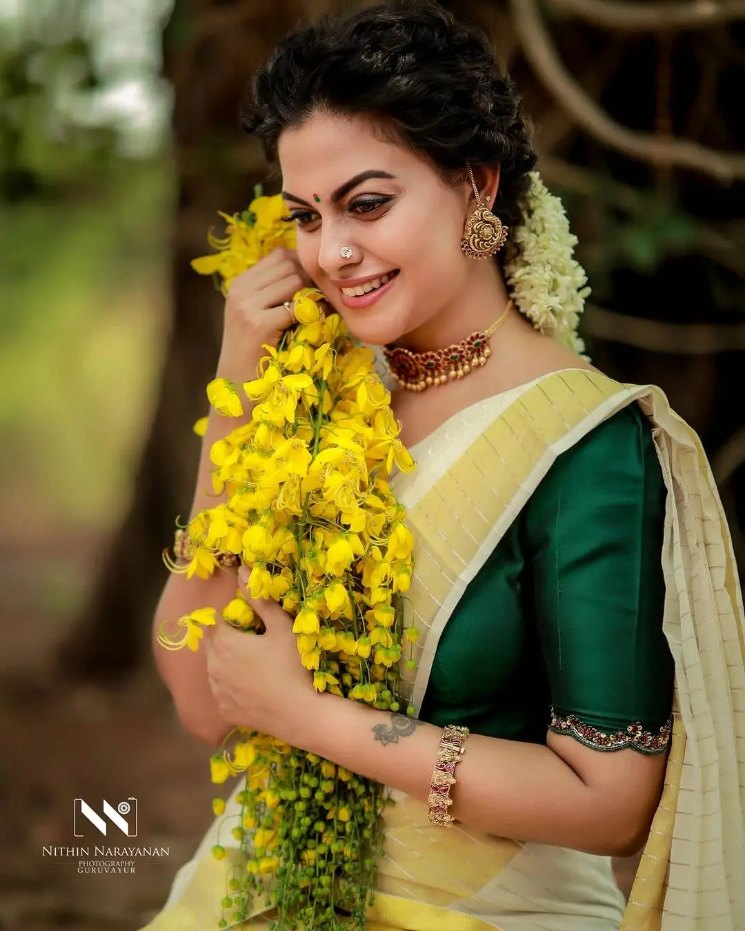 Anusree Nair In Beautiful Earrings Jewellery White Saree Green Blouse